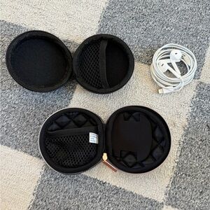 Two Earbud Travel Cases and Apple Headphones
